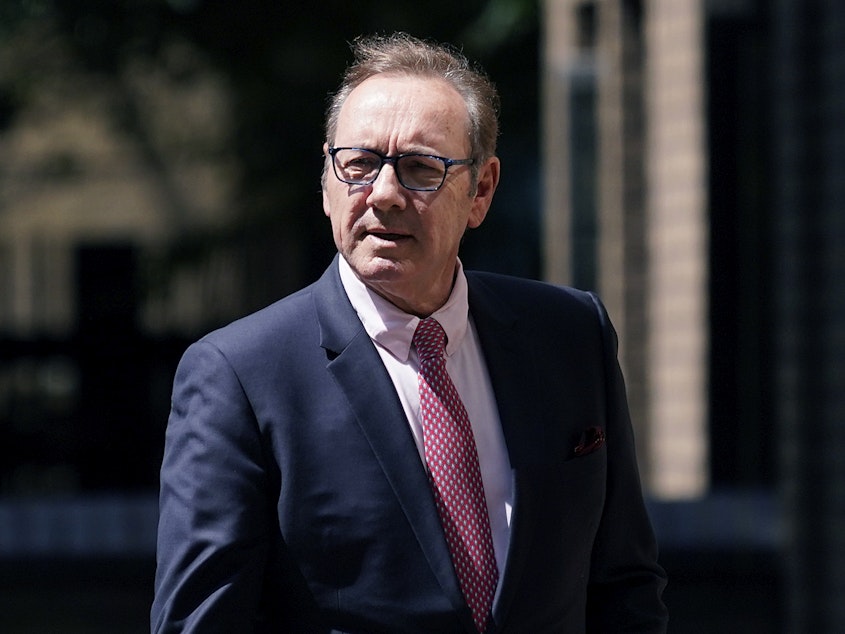 caption: Actor Kevin Spacey walks outside Southwark Crown Court in London, Wednesday.