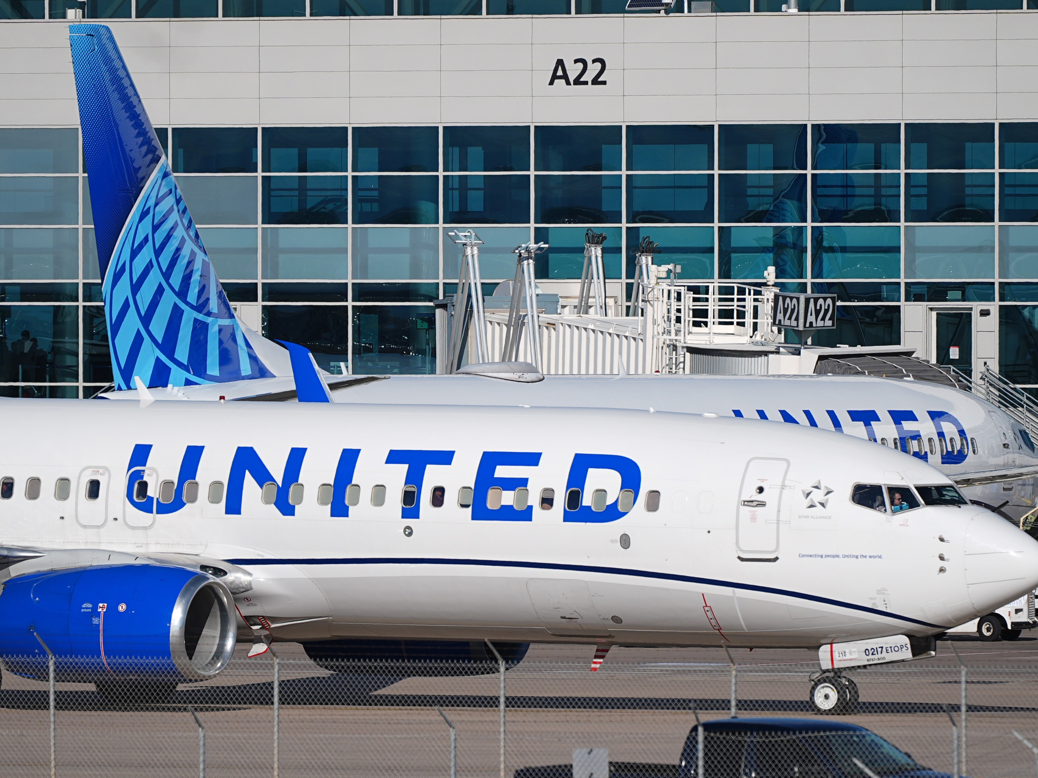 caption: United Airlines jetliner is seen at Denver International Airport Tuesday, Nov. 25, 2025, in Denver.