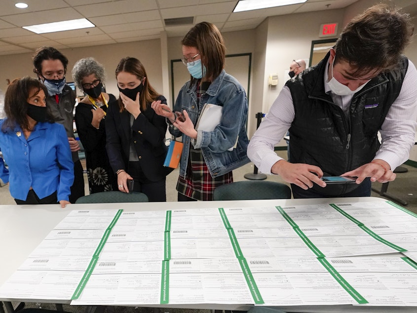 caption: Democratic and Republican canvas observers inspect Lehigh County provisional ballots as vote counting in the general election continued on Friday.