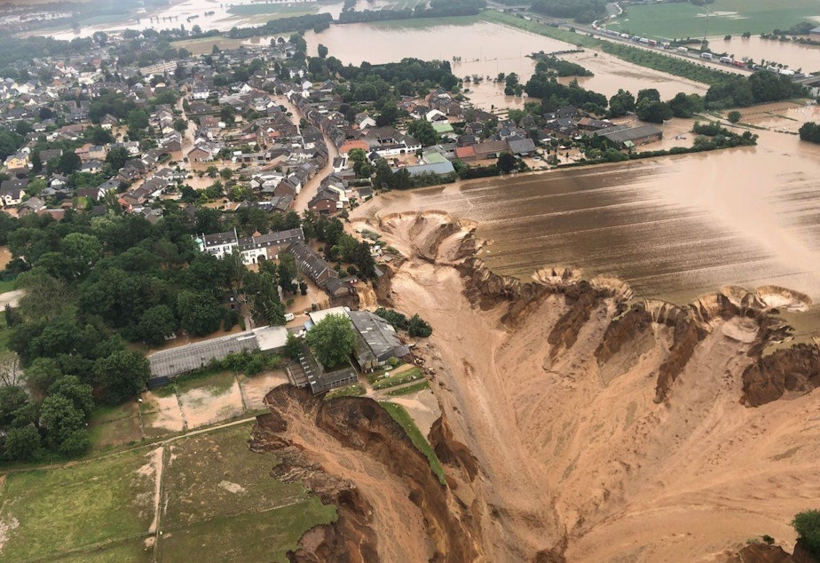 caption: Photos released by the Cologne district authority on Friday, and taken by the Rhein-Erft-Kreis district, show an entire section of a field having collapsed.