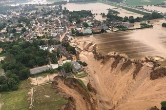 caption: Photos released by the Cologne district authority on Friday, and taken by the Rhein-Erft-Kreis district, show an entire section of a field having collapsed.