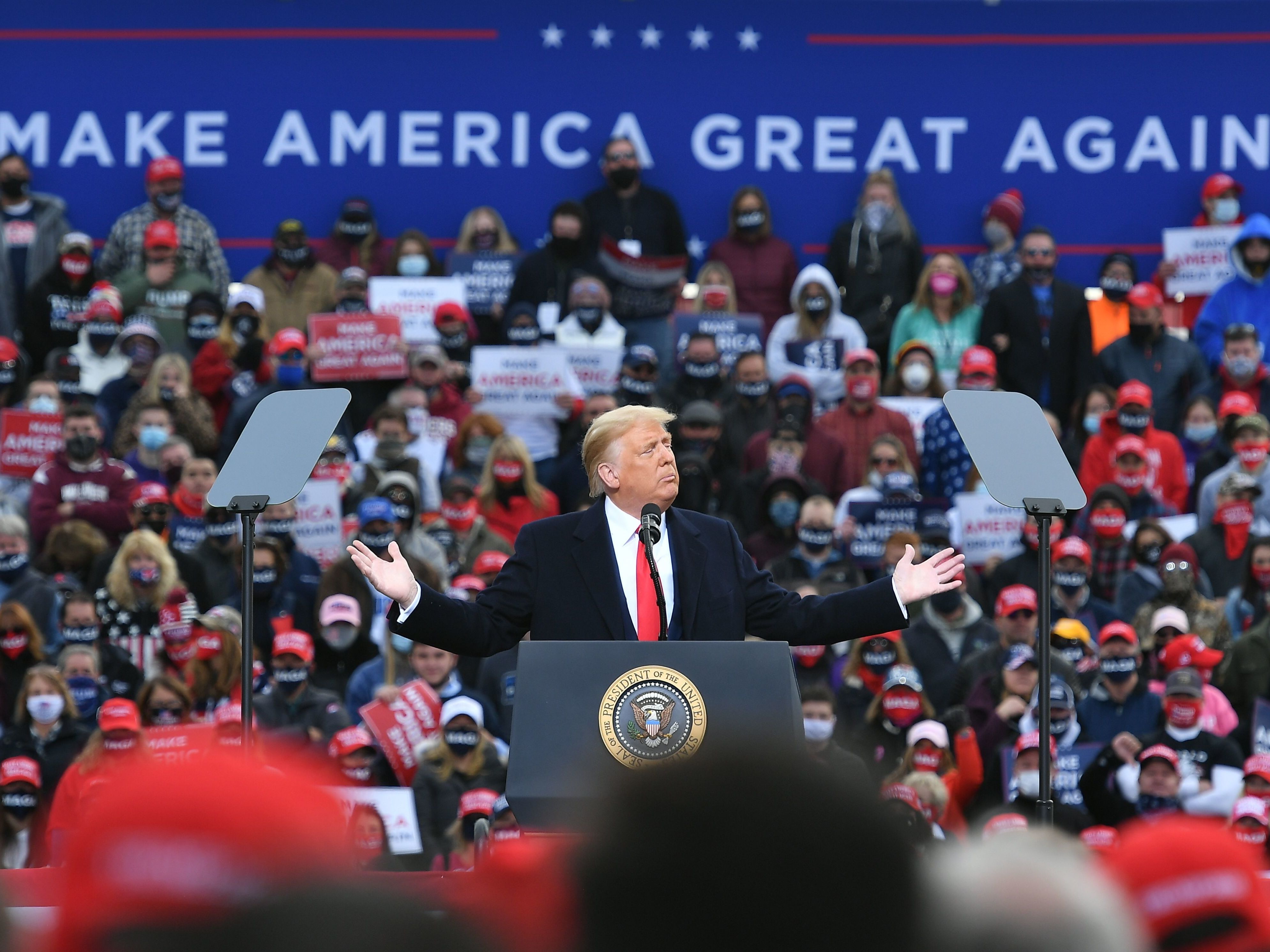 caption: President Trump holds a rally in Londonderry, N.H., on Sunday.