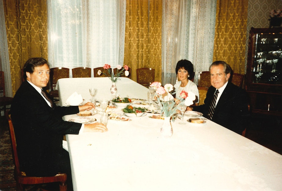 caption: Former Secret Service Agent Mike Endicott and former President Richard Nixon dine at a guest house in Moscow. The back of the old photo says with “Adriana Honig in Moscow guest house during a private visit.” 