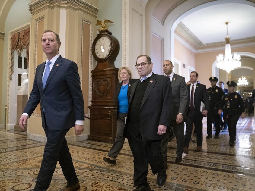 caption: House Democratic impeachment managers led by Intelligence Committee Chairman Adam Schiff of California arrive for the start of the Senate trial on Tuesday. The managers begin opening arguments on Wednesday.