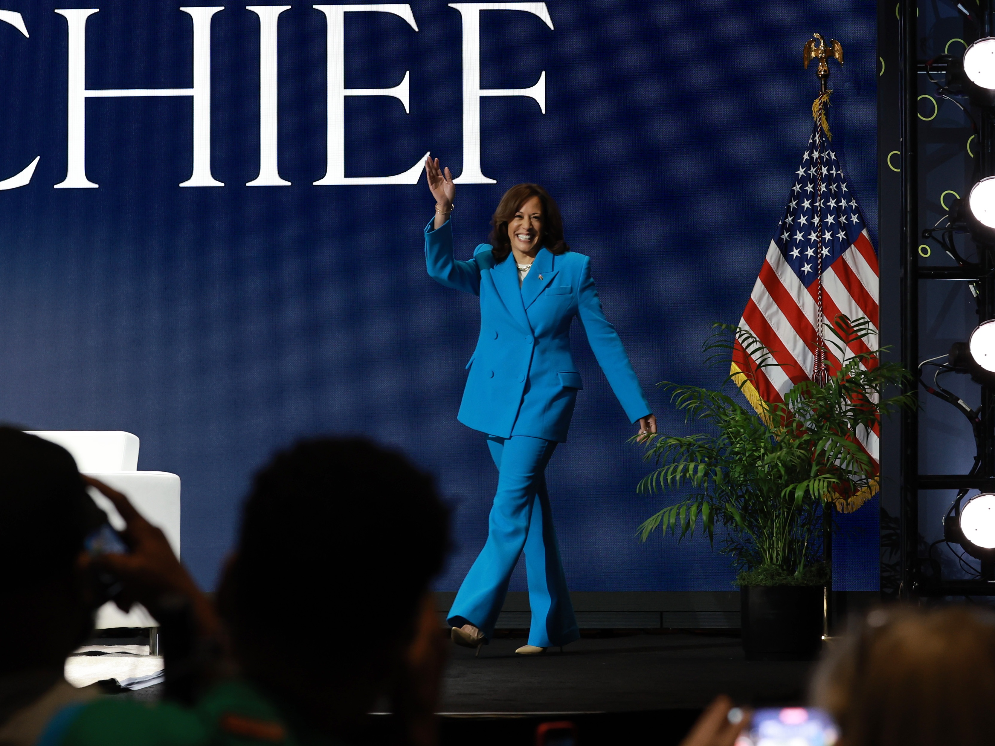 caption: Vice President Harris walks onstage at the 2024 Essence Festival in New Orleans on July 6.