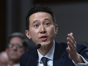 caption: TikTok CEO Shou Zi Chew testifies before a Senate committee in Washington on Wednesday.