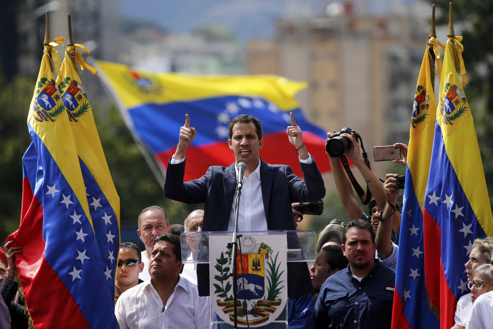 caption: Juan Guaido, head of Venezuela's opposition-run congress, declares himself interim president of the nation until elections can be held during a rally demanding President Nicolas Maduro's resignation in Caracas, Venezuela, Wednesday, Jan. 23, 2019. (Fernando Llano/AP)