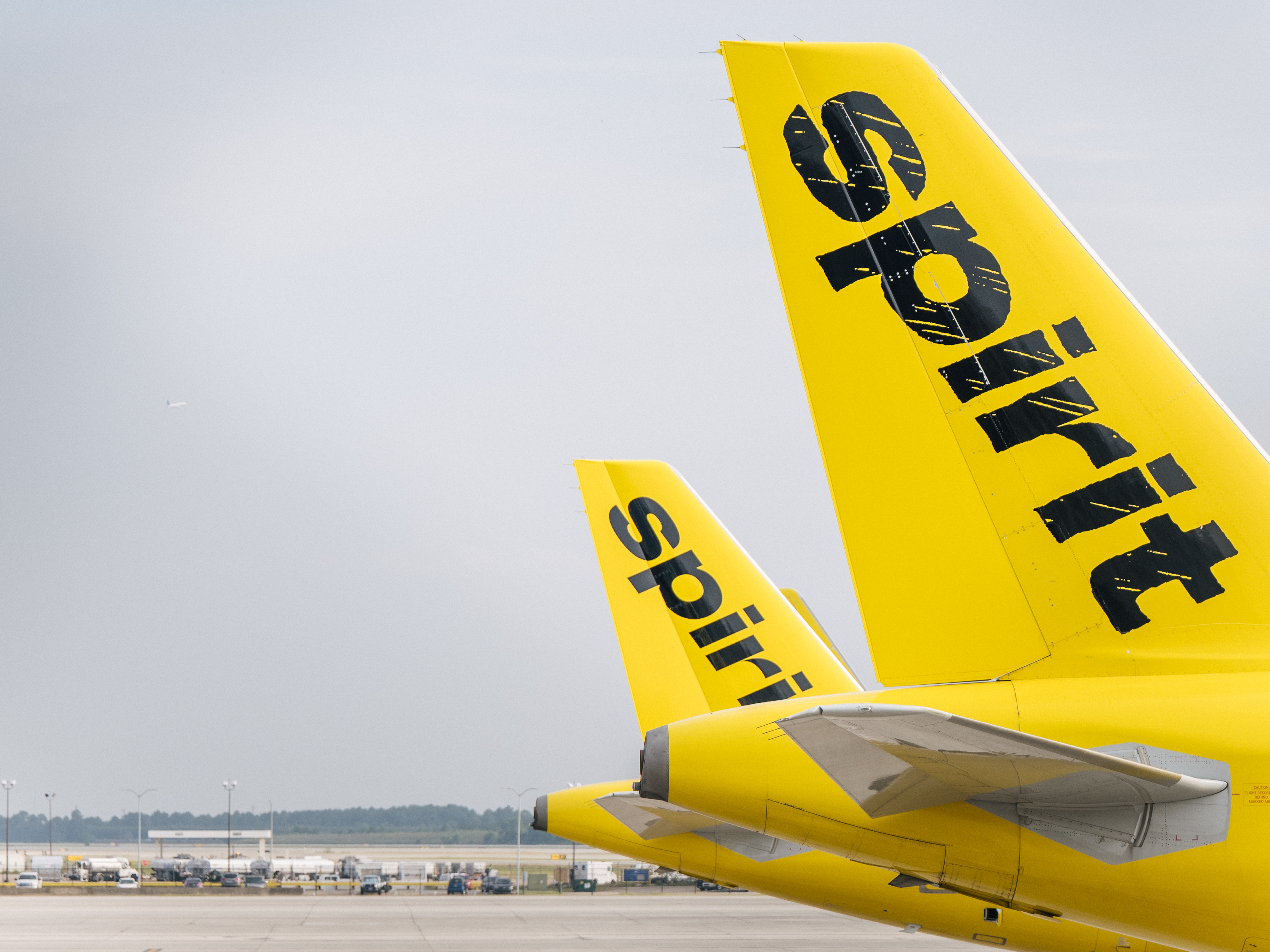 caption: Spirit Airlines aircrafts are shown at the George Bush Intercontinental Airport on August 05, 2021 in Houston, Texas.