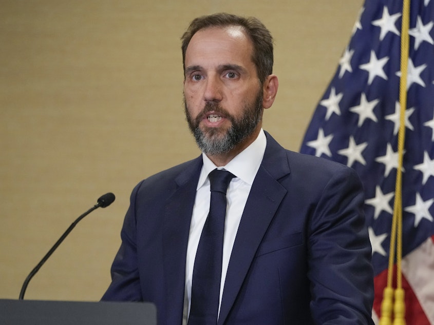 caption: Special counsel Jack Smith speaks about an indictment of former President Donald Trump on Tuesday at a Department of Justice office in Washington.