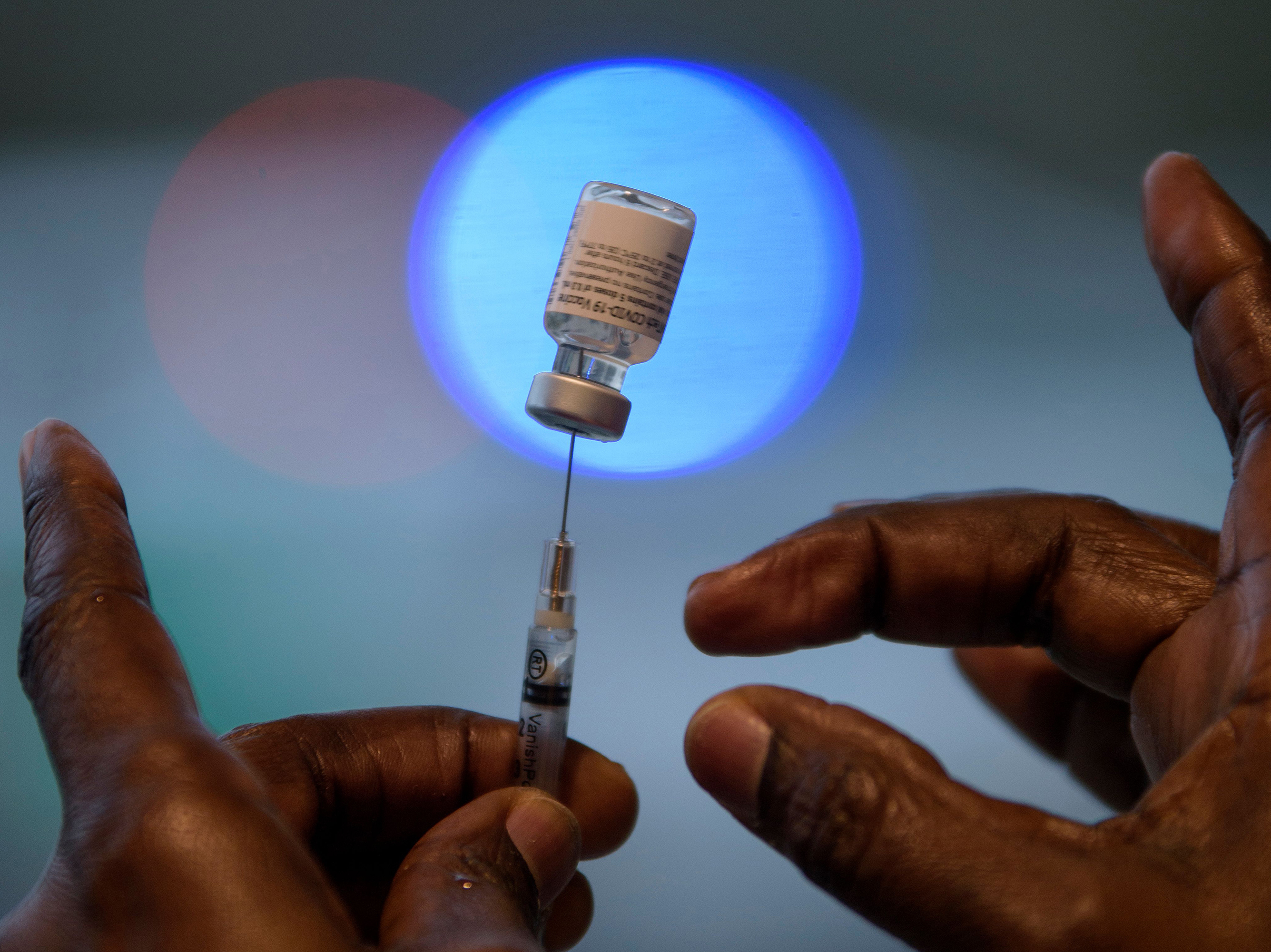 caption: Vaccine makers are moving to test booster shots, prompted by new coronavirus variants that have sprung up in South Africa, the U.K. and elsewhere.