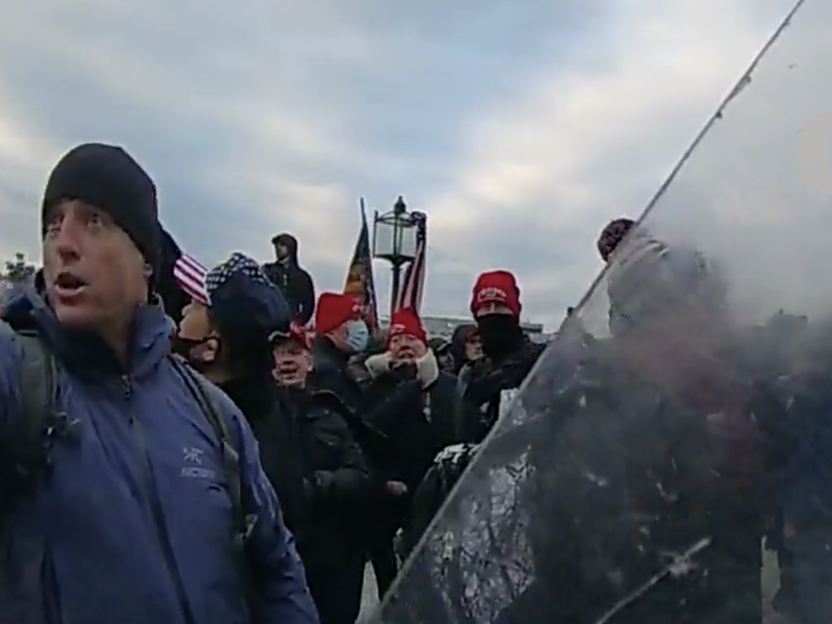 caption: A screenshot of Jared Wise joining the crowd at the U.S. Capitol on Jan. 6, 2021.