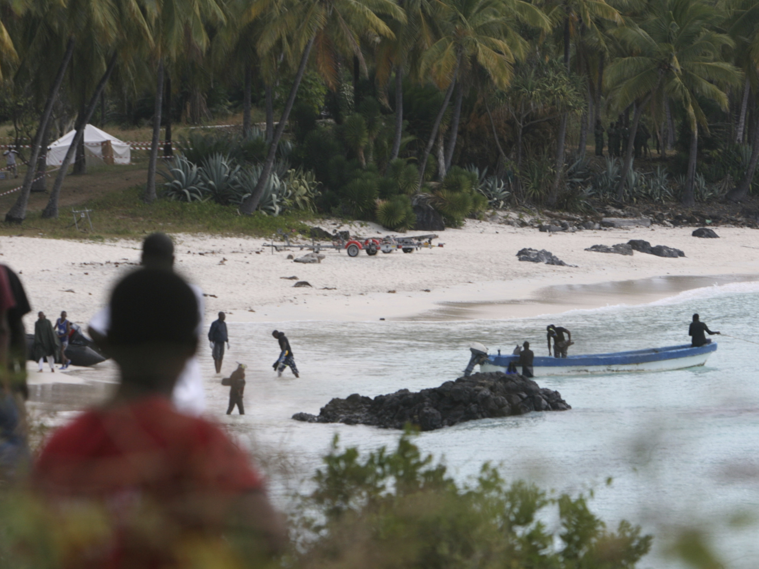 caption: Rescuers gather at Galawa Beach, about 22 miles from Moroni, Comoros, July 1, 2009, as they prepare to search the area after a Yemenia Airbus passenger plane crashed into the Indian Ocean off the island nation of Comoros as it attempted to land in the dark amid howling winds.