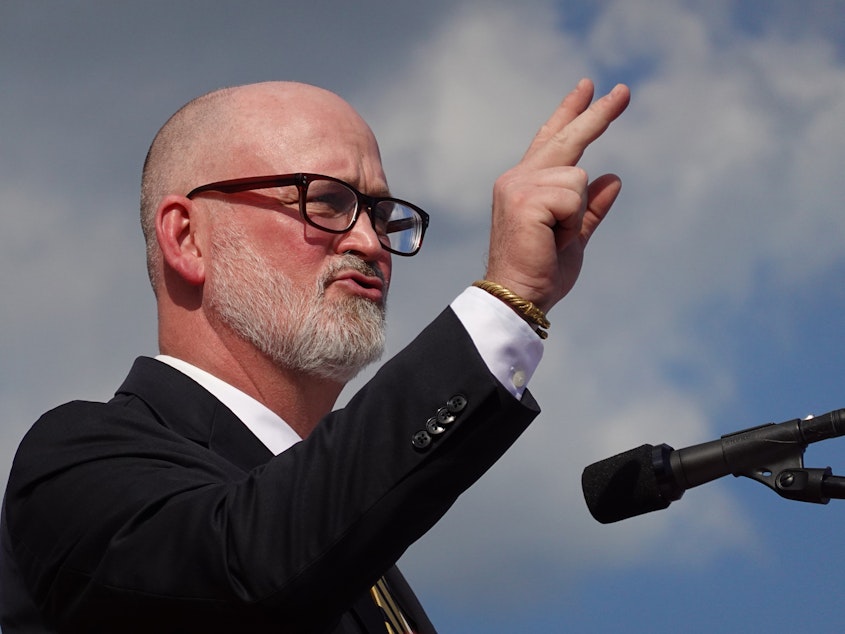 caption: Derrick Van Orden speaks in Waukesha, Wis., on Aug. 5, 2022. The Republican congressman has refused to apologize for his outburst in Washington this week — insisting that he was protecting the integrity of the Capitol Rotunda.