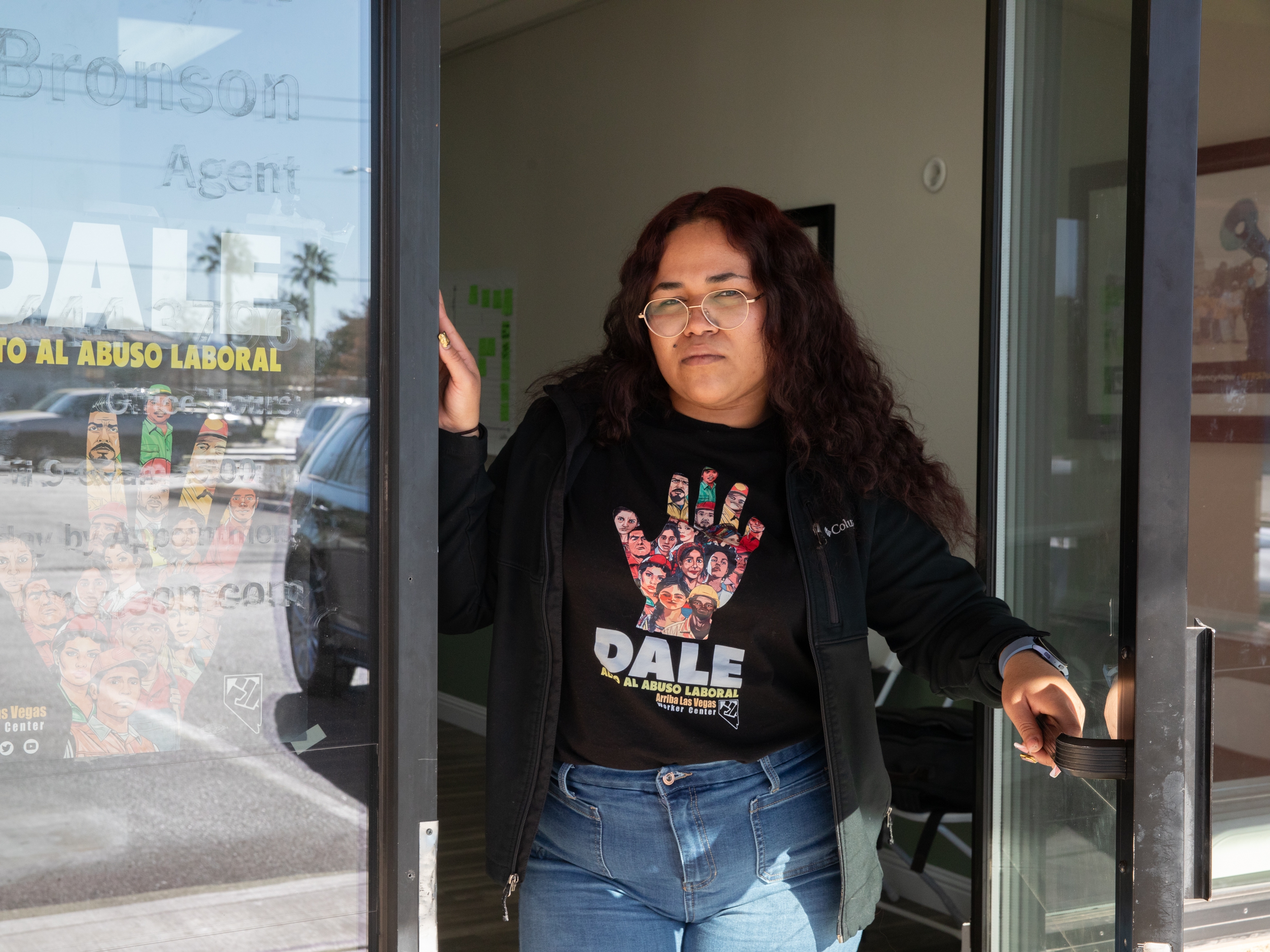 caption: Labor organizer Karin Martinez stands in the doorway at the Arriba Las Vegas Worker Center in Las Vegas, Nev., on January 13, 2025.