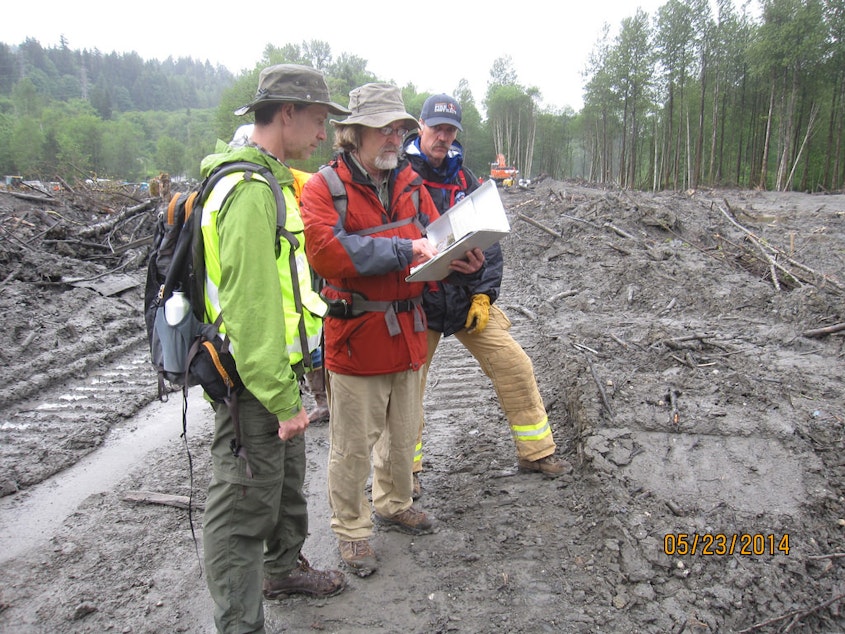 caption: Reviewing their field notes on observations made during the Geotechnical Extreme Events Reconnaissance investigation of the 2014 Oso Landslide are Civil & Environmental Engineering Associate Professor Joe Wartman and Earth & Space Sciences Professor Dave Montgomery. Photo taken in April 2014.
