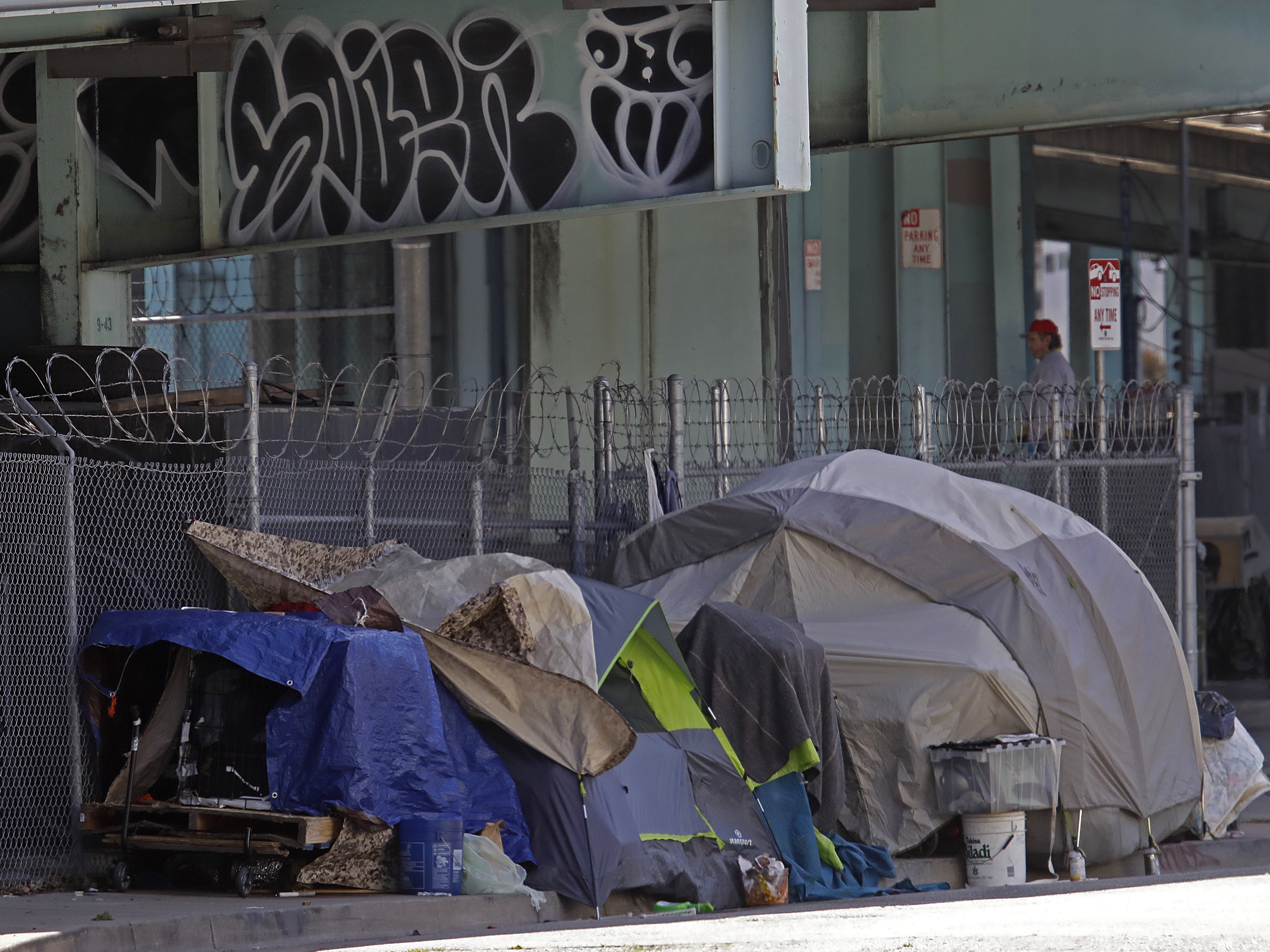 caption: A homeless encampment seen on Monday in San Francisco. City lawmakers are demanding that the mayor step up efforts to house the city's homeless population to protect them from COVID-19.
