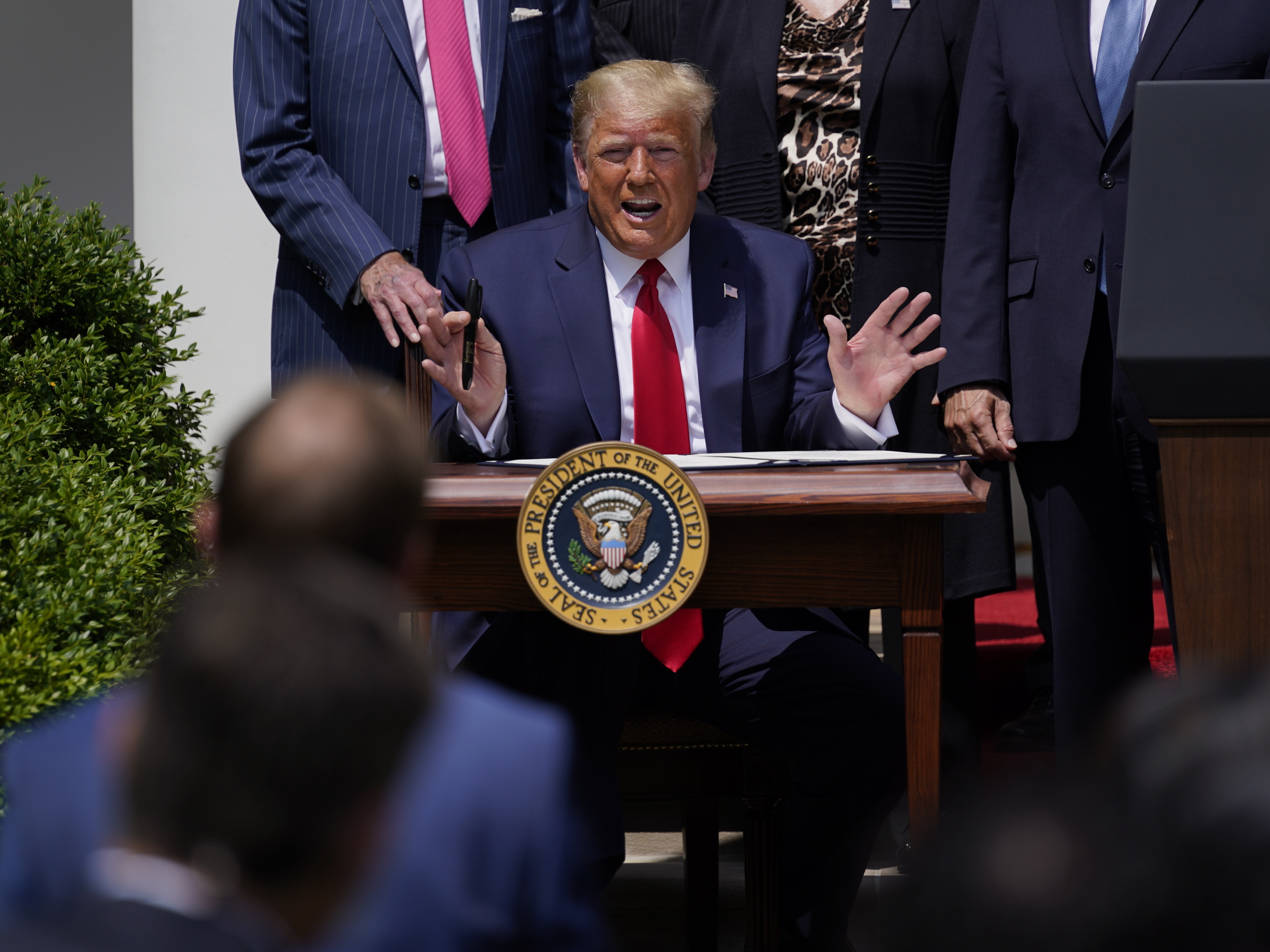 caption: President Trump says a strong economy is his solution to racial injustice in America.