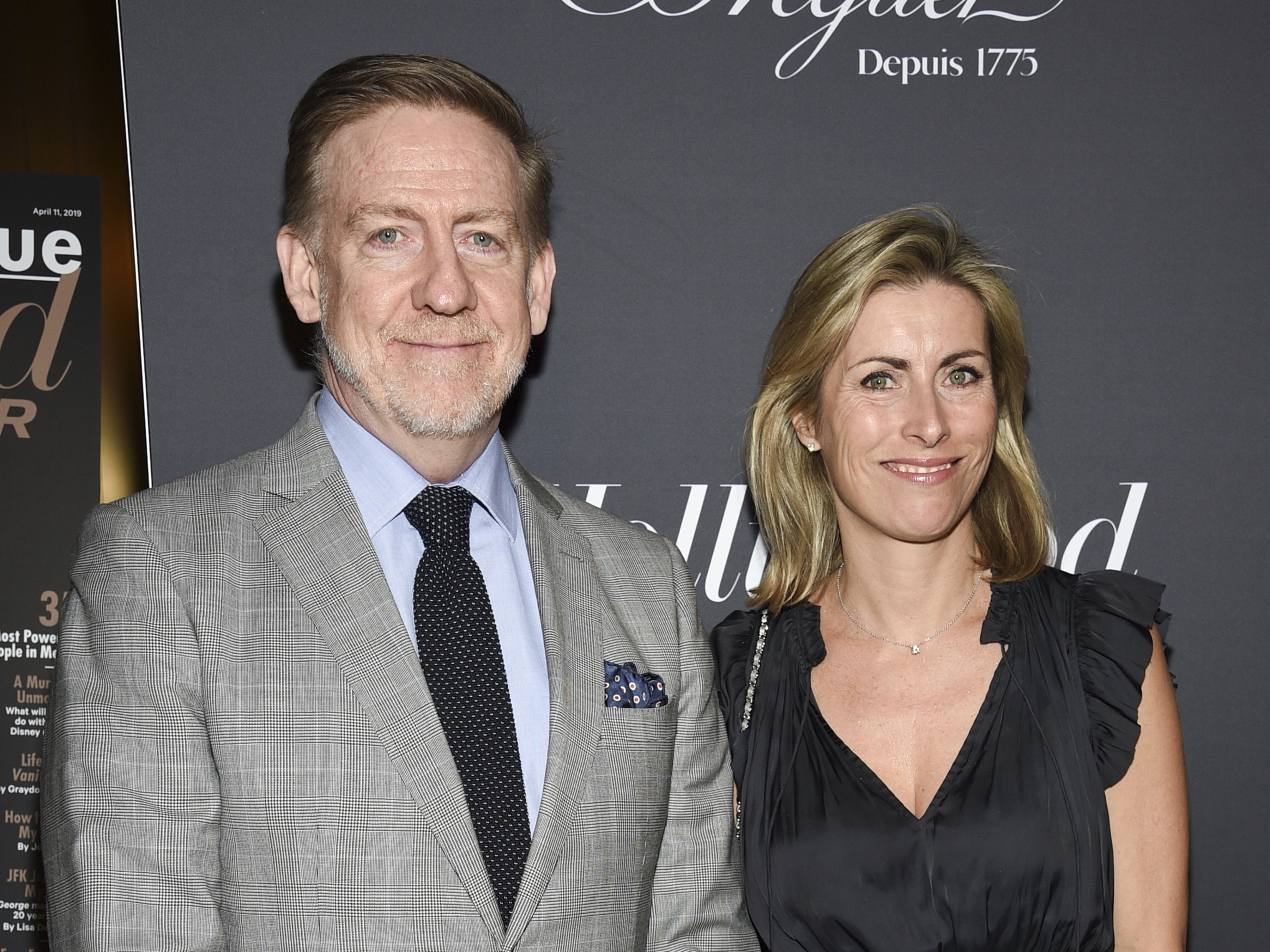 caption: "60 Minutes" executive producer Bill Owens, left, shown with executive editor Tanya Simon in 2019. Owens resigned Tuesday, saying corporate leaders were no longer letting him "make independent decisions based on what was right for 60 Minutes, right for the audience."