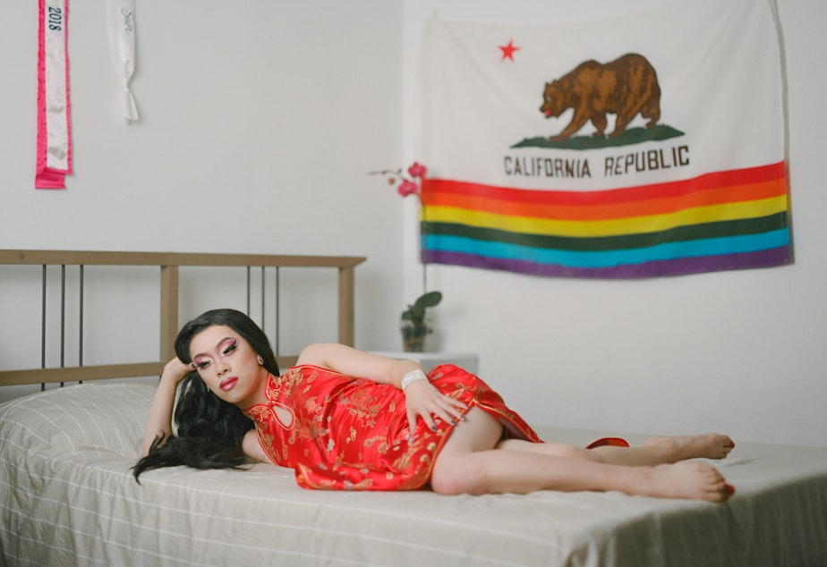 caption: Portrait of Jeffrey in drag in his bedroom from Brooklyn-based photographer Andrew Kung's series The All-American. Kung says this series aims to examine masculinity and what it means to be American within the context the stereotype of the desexualized Asian man. 