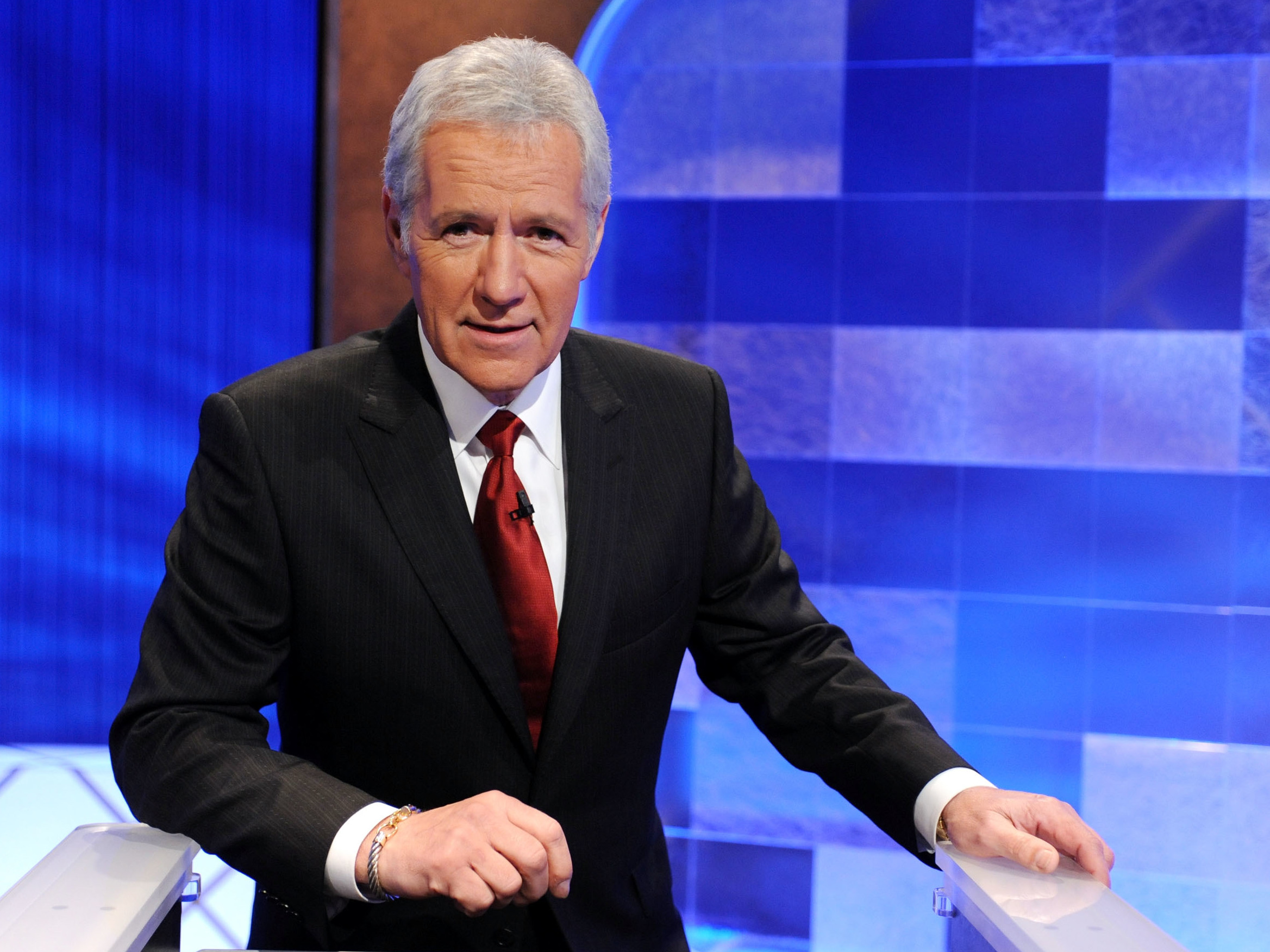 caption: Trebek said he hated to see contestants lose for forgetting to phrase their answers as questions. "I'm there to see that the contestants do as well as they can within the context of the rules," he told <em></em><em>Fresh Air'</em>s Terry Gross in 1987. Above, Trebek poses on set in April 2010.