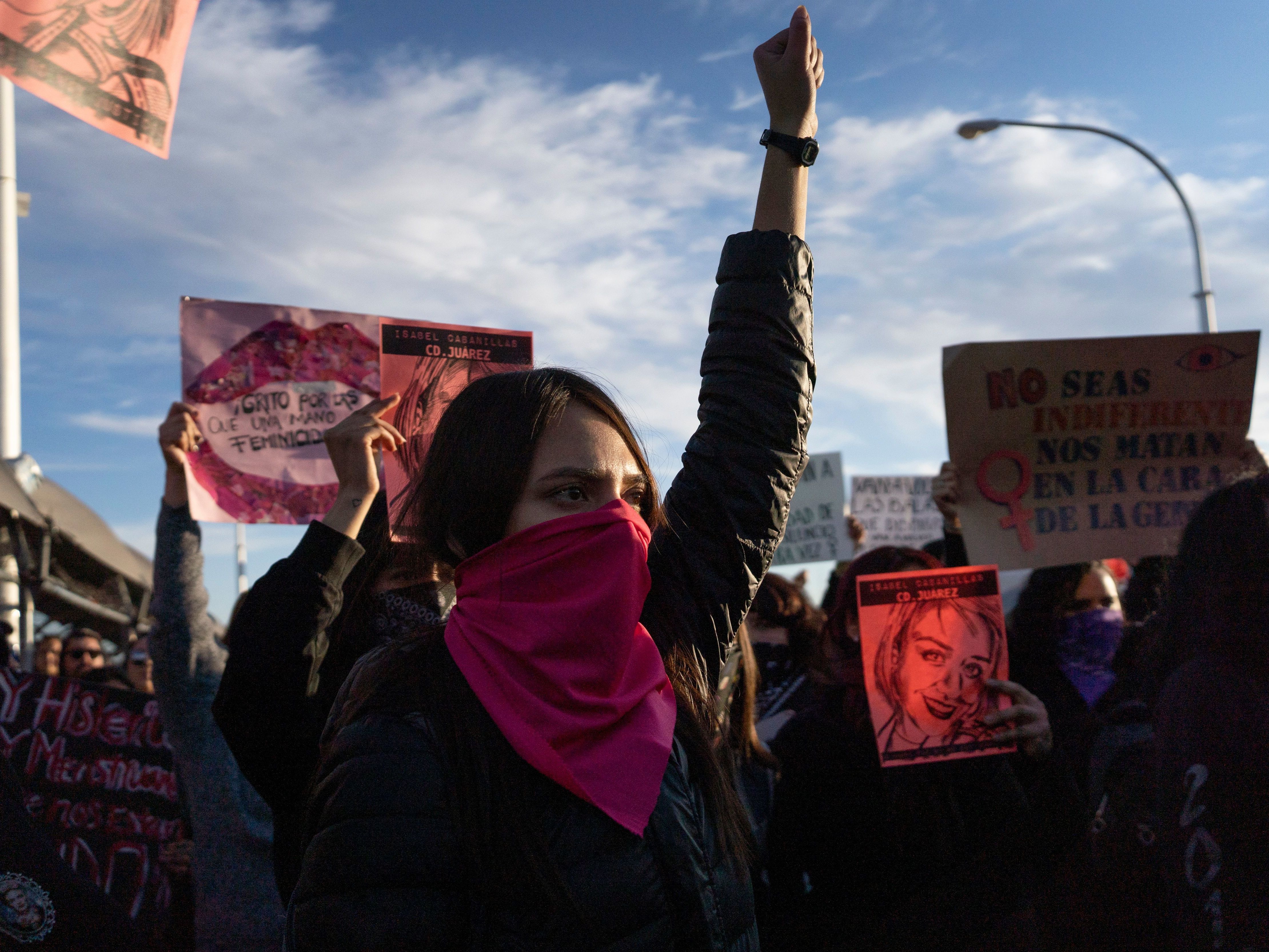 caption: Protesters gather on the Paso del Norte International Bridge in Ciudad Juarez, Mexico on Saturday to demand justice for artist and activist Isabel Cabanillas, 26, who was killed in the streets of Juarez, Mexico.