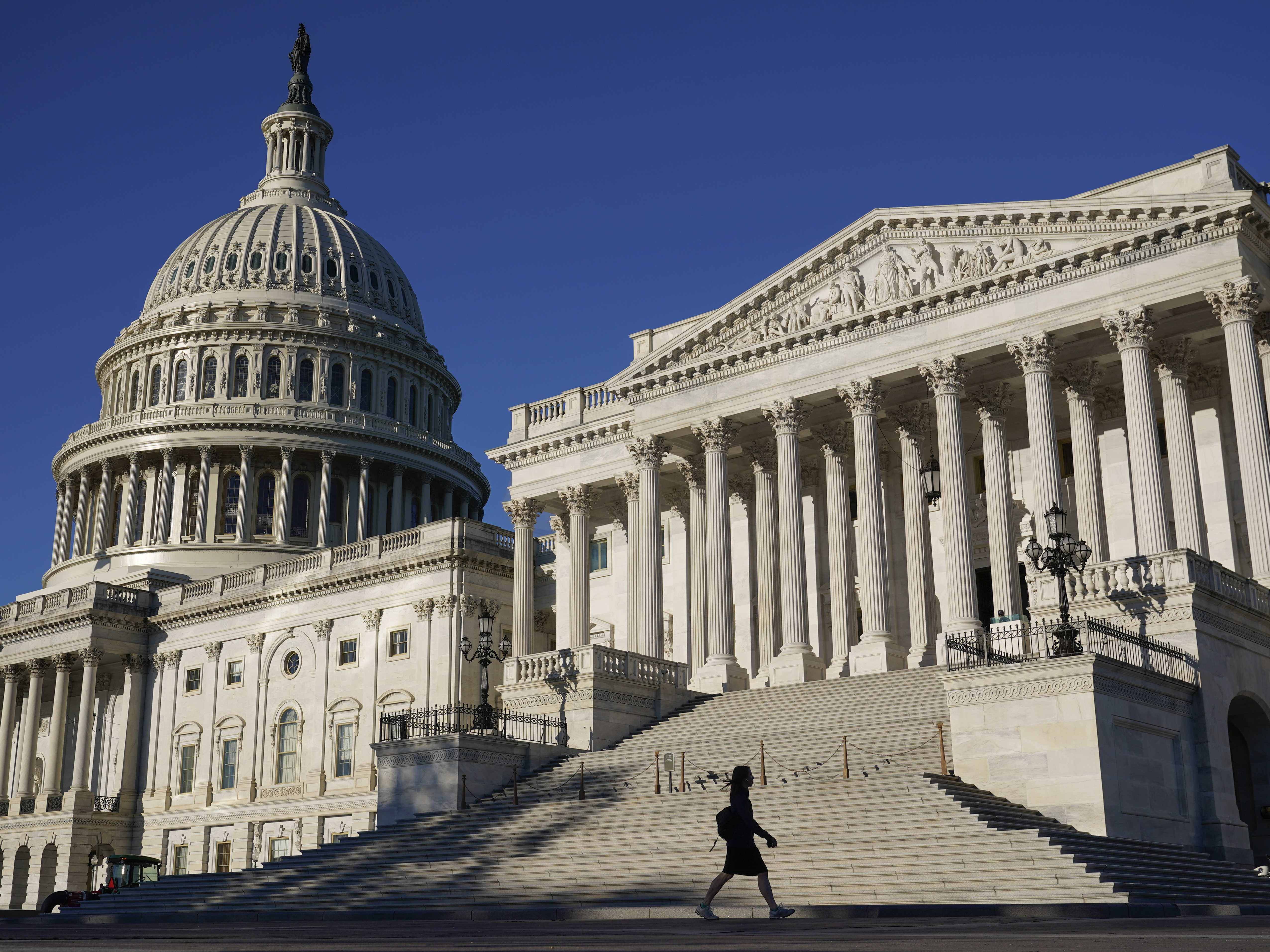 caption: Congress is moving to avert one crisis while putting off another. The Senate approved legislation Thursday that would fund the federal government through Dec. 3.
