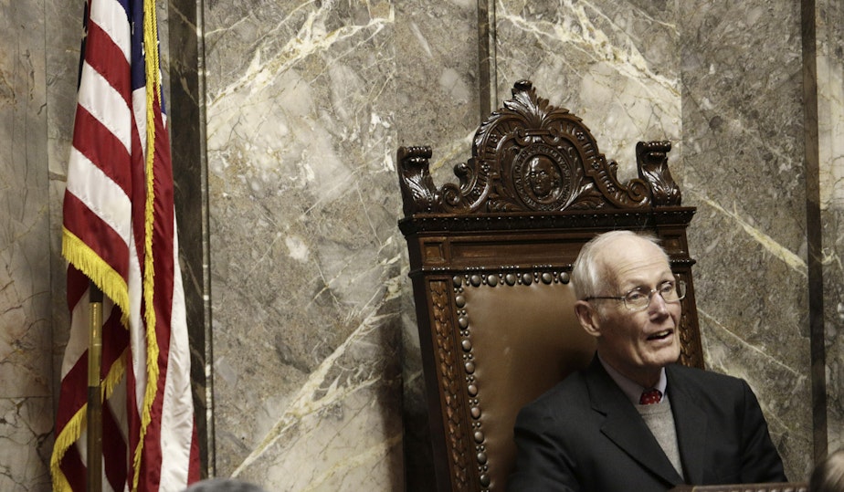caption: Former state attorney Slade Gorton, who is also a former U.S. senator, listens as former Gov. Dan Evans sits in the Washington state Senate chamber on Wednesday, Jan. 14, 2015, in Olympia Wash. Evans, who served three terms as governor and later was a U.S. senator, was honored with a resolution for his years of public service.