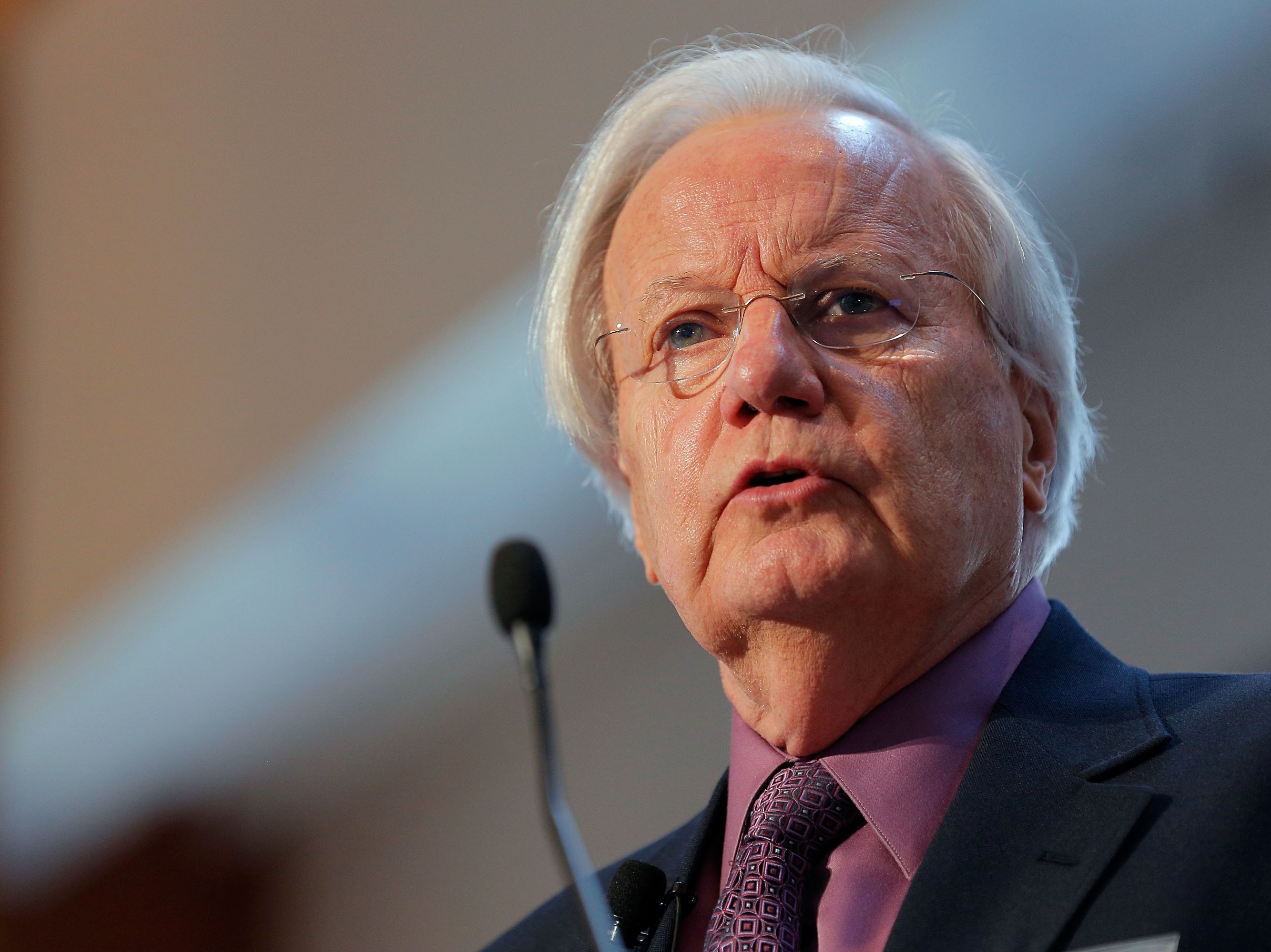 caption: Journalist Bill Moyers moderates the "All Hands on Deck: Perspectives from Higher Education, Government, Philanthropy and Business" panel during the TIME Summit On Higher Education on October 18, 2012 in New York City.
