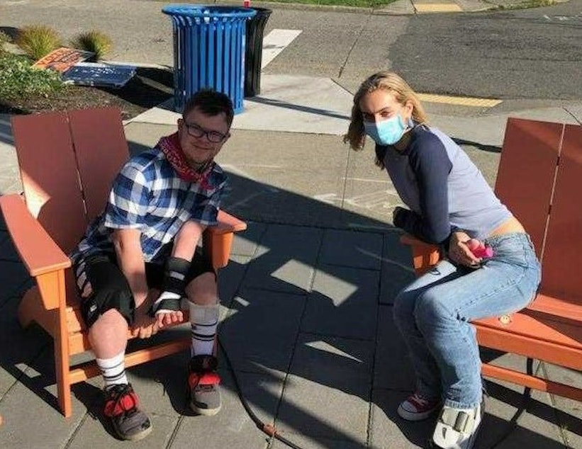 caption: RadioActive Youth Producer Lily Turner poses with Roosevelt junior Maxford Brown.