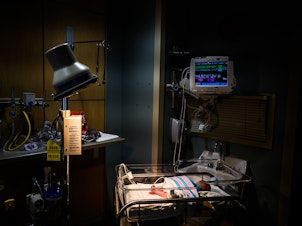 caption: Infants exposed to opioids in utero often experience symptoms of withdrawal. An infant is being monitored for opioid withdrawal inside a neonatal intensive care unit at the CAMC Women and Children's Hospital in June 2019, in Charleston, W.Va.