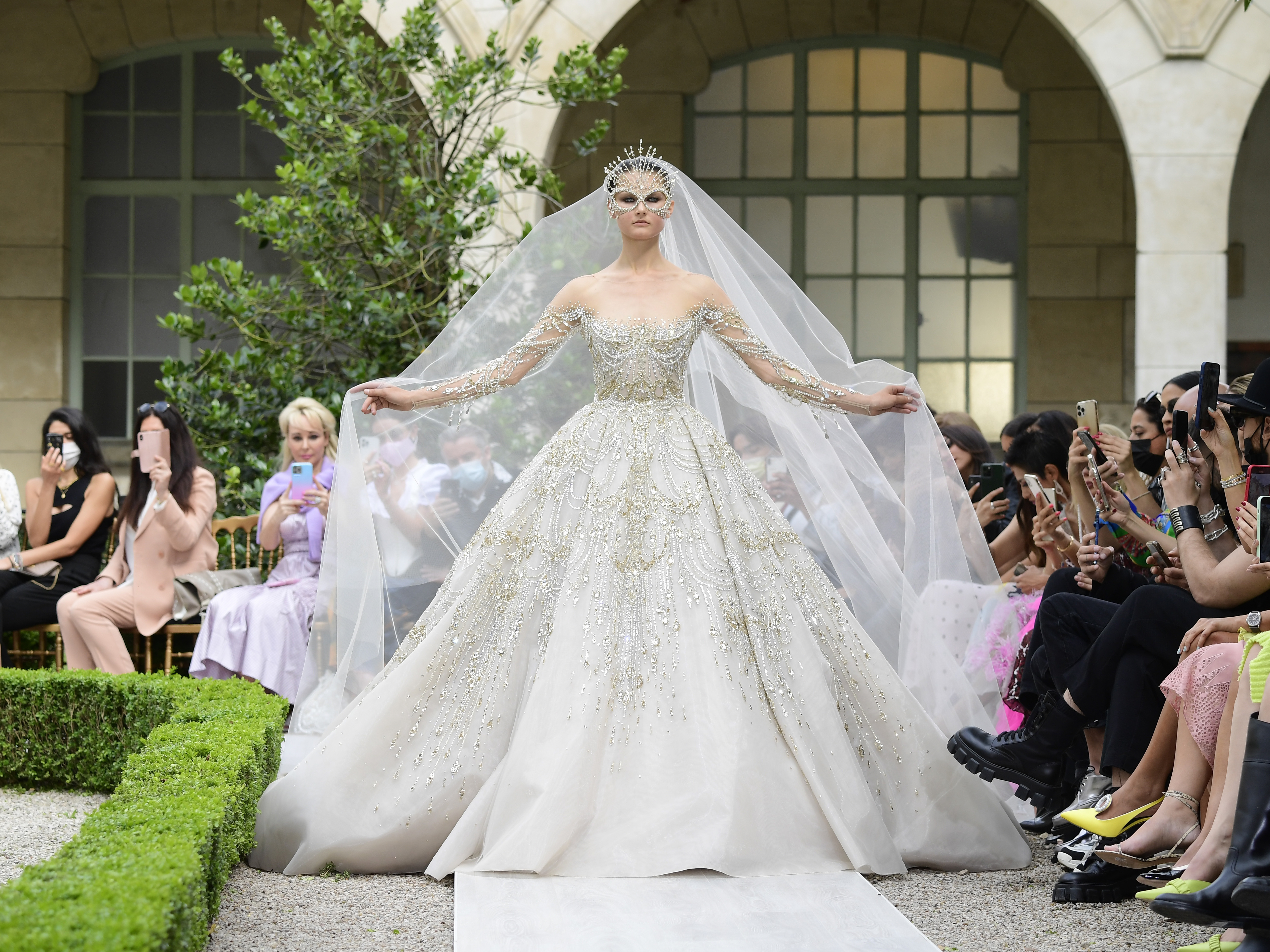 caption: A model walks the runway during the Zuhair Murad Couture Haute Couture Fall/Winter 2021/2022 show as part of Paris Fashion Week on July 7, 2021.