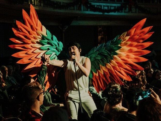 caption: Drag king Freddie Hercury performs at an event in Homer, N.Y., in 2023. The artist faced an online bomb threat in the run-up to a Pride performance in 2024.