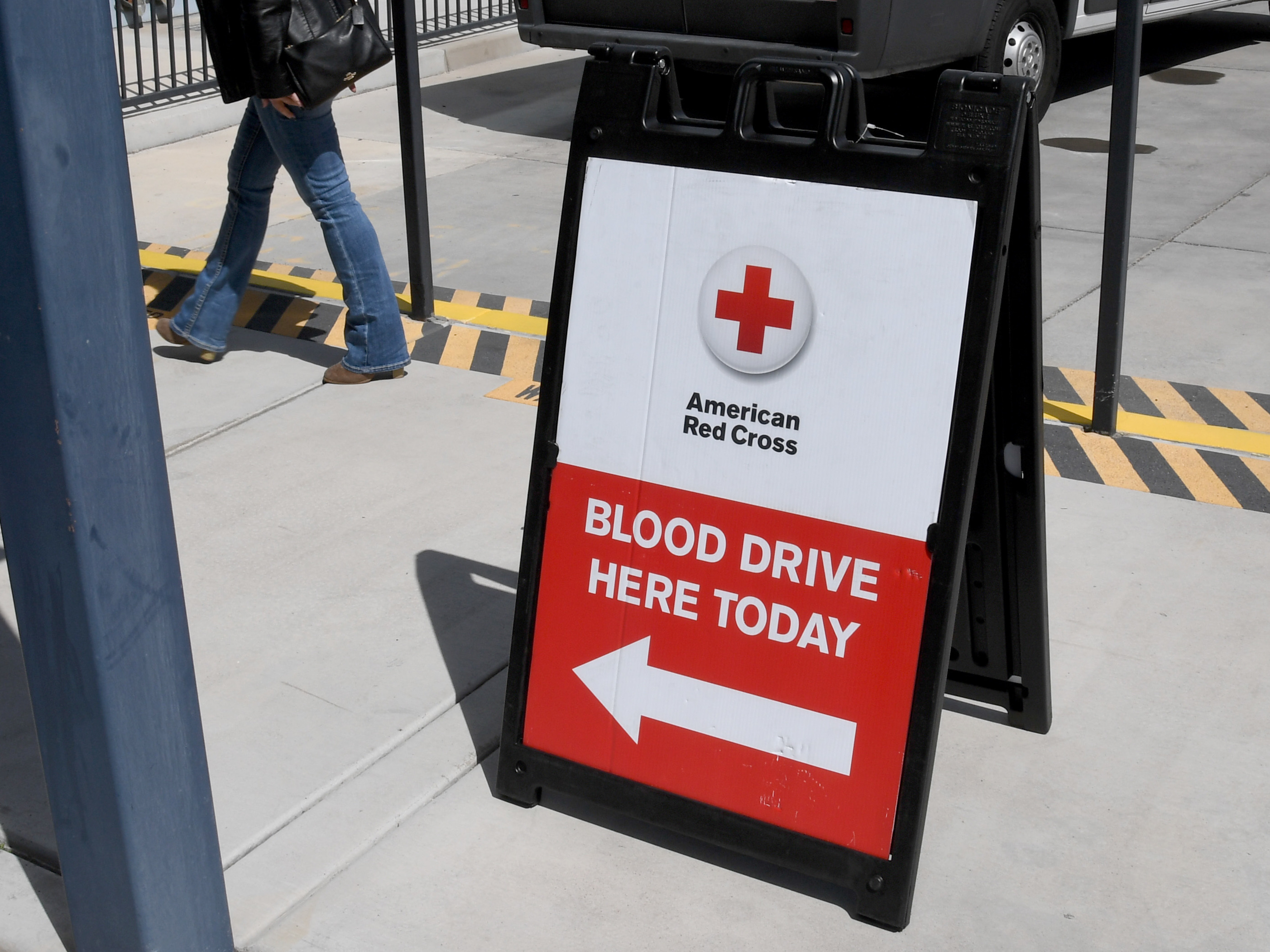 caption: A woman arrives at an American Red Cross blood drive held to help alleviate a blood supply shortage as a result of the coronavirus pandemic at Las Vegas Motor Speedway in March 2020 in Las Vegas.