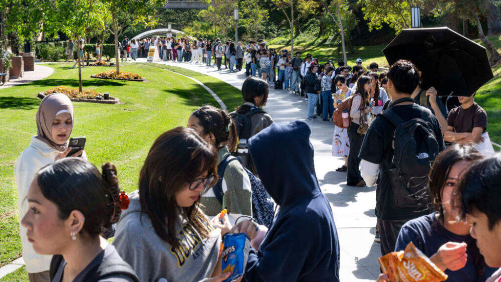 caption: Students wait in line to vote at the student center at the University of California, Irvine in Irvine, CA on Tuesday, November 5, 2024. (Photo by Paul Bersebach/MediaNews Group/Orange County Register via Getty Images)