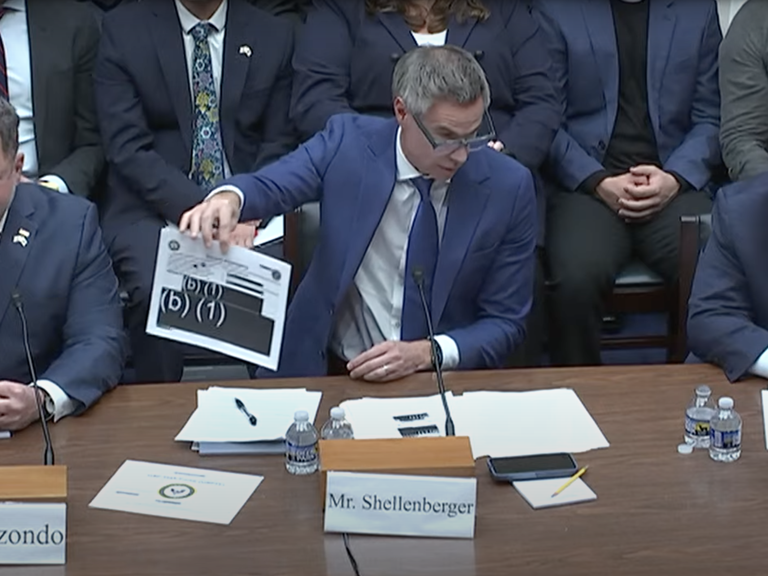 caption: Journalist Michael Shellenberger, founder of the Public news outlet, displays redacted reports during a hearing on Capitol Hill Wednesday as he stresses the need for more transparency over UAP investigations.