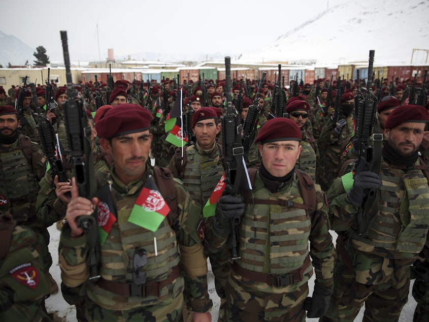 caption: Afghan Army commandos attend their graduation ceremony after a 3 1/2-month training program, at the Commando Training Center on the outskirts of Kabul, Afghanistan, on Monday.