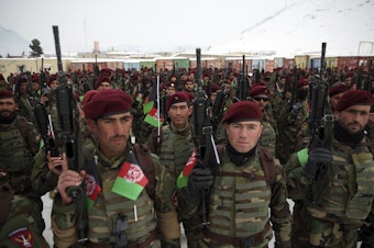 caption: Afghan Army commandos attend their graduation ceremony after a 3 1/2-month training program, at the Commando Training Center on the outskirts of Kabul, Afghanistan, on Monday.