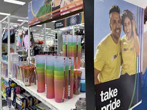 caption: Target confirmed that it won't be carrying its LGBTQ+ merchandise for Pride month this June in some stores after the discount retailer received backlash last year. Here, Pride month merchandise is displayed at a Target store in Nashville, Tenn, in May 2023.
