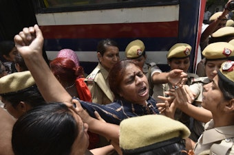 caption: Police detain women during a protest in front of the Supreme Court building in New Delhi in May. The demonstration was in response to Chief Justice Ranjan Gogoi's exoneration in a sexual harassment case.