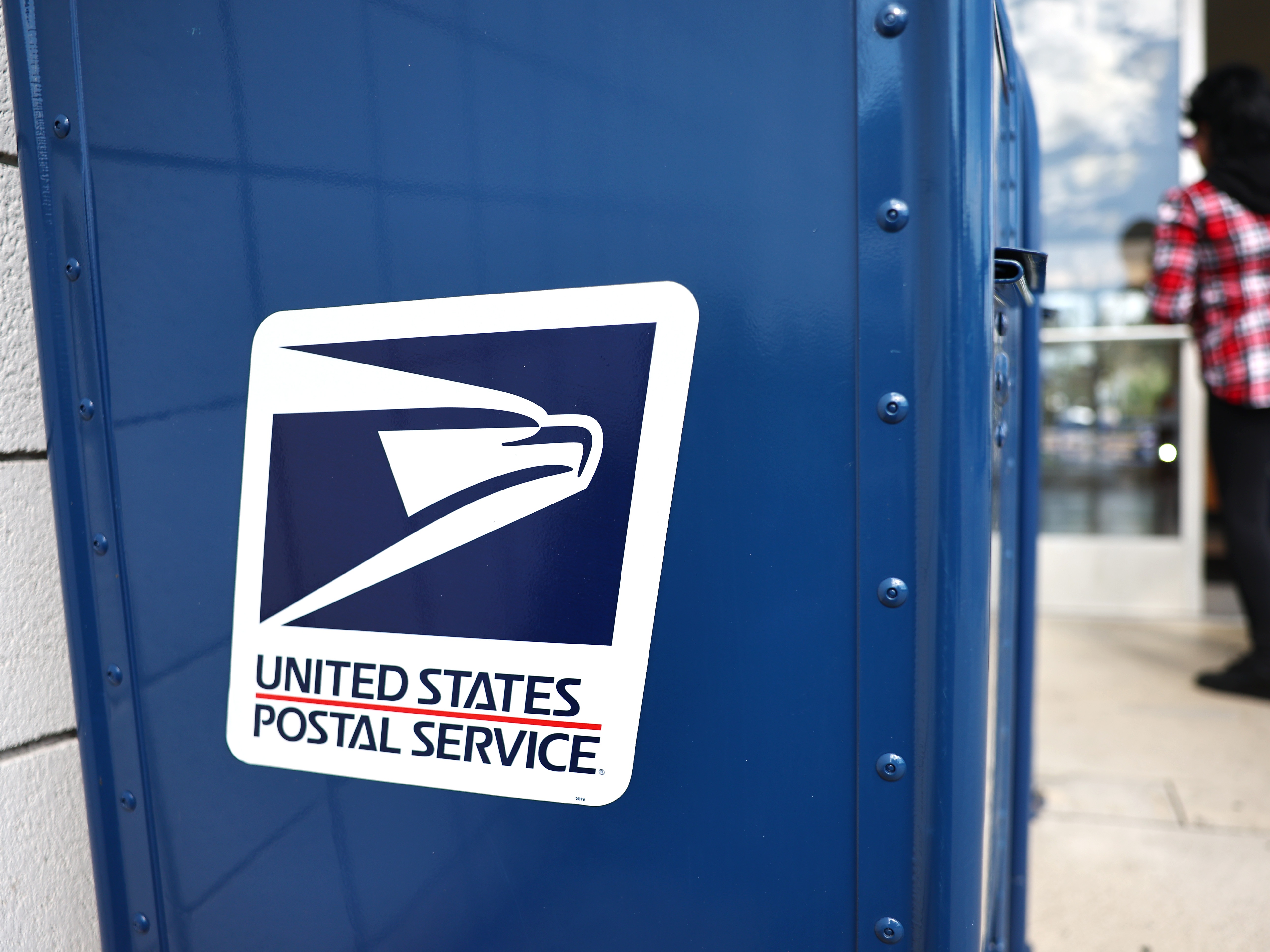 caption: In response to U.S. Postal Service changes, California state officials are urging mail-in voters for a special election on congressional redistricting to return their ballots before Election Day to help ensure their ballots get postmarked by the deadline. Here, a post office in Montclair, Calif., is seen last year.