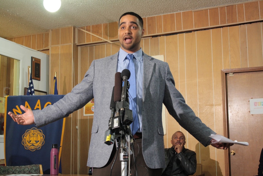 caption: Garfield Teacher Jesse Hagopian says rising standards plus inadequate education funding means minorities lose. Behind him sits Gerald Hankerson of the Seattle King County NAACP. Hankerson's comments suggested his group will consider a lawsuit.