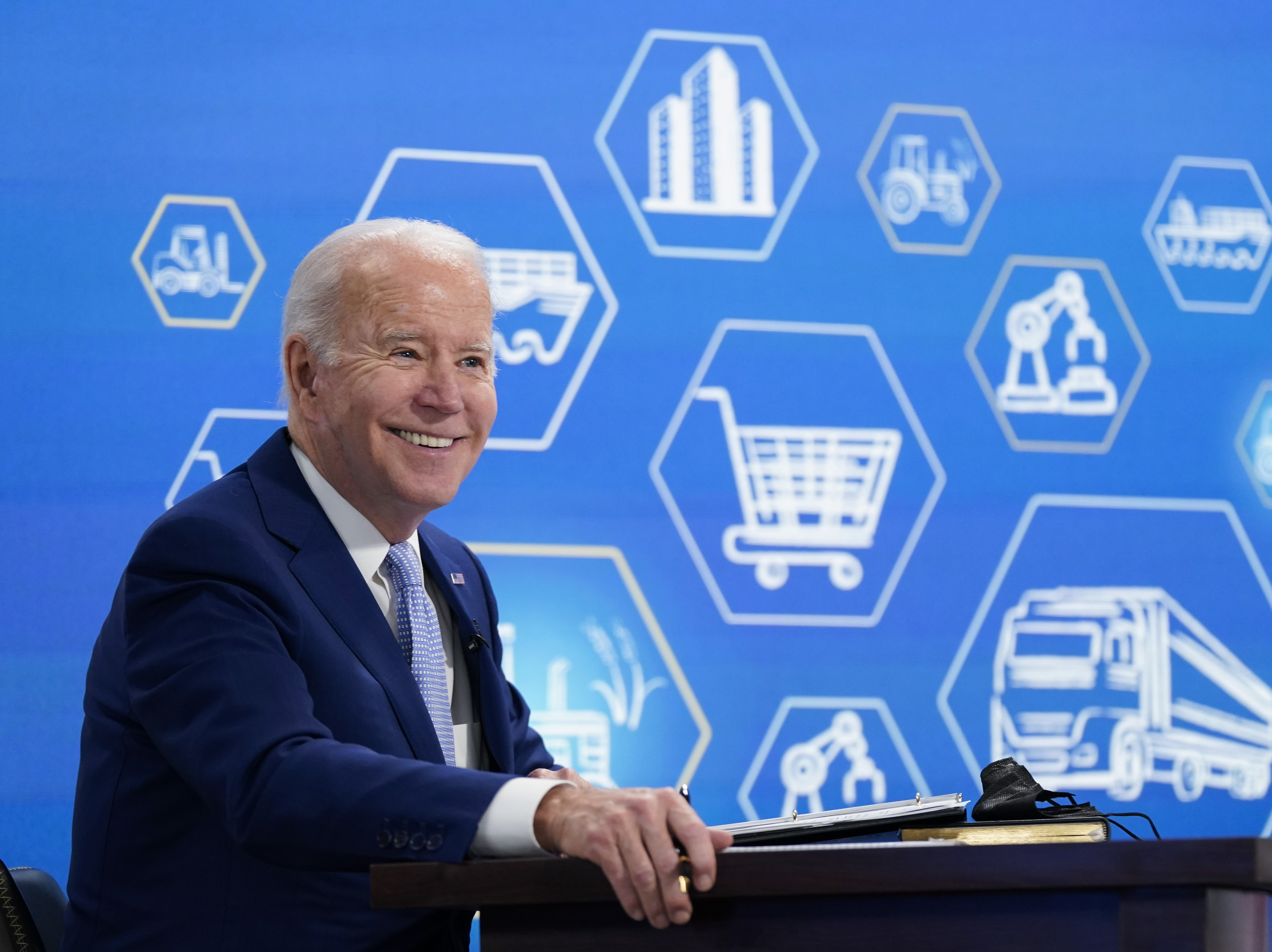 caption: President Joe Biden listens during a meeting with his task force on supply chain issues on Wednesday.