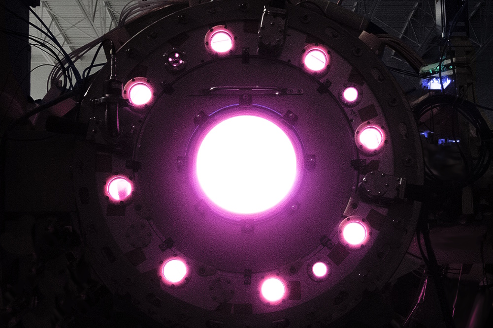 caption: Helion's polaris reactor lights up as nuclear fusion creates a burst of power inside.