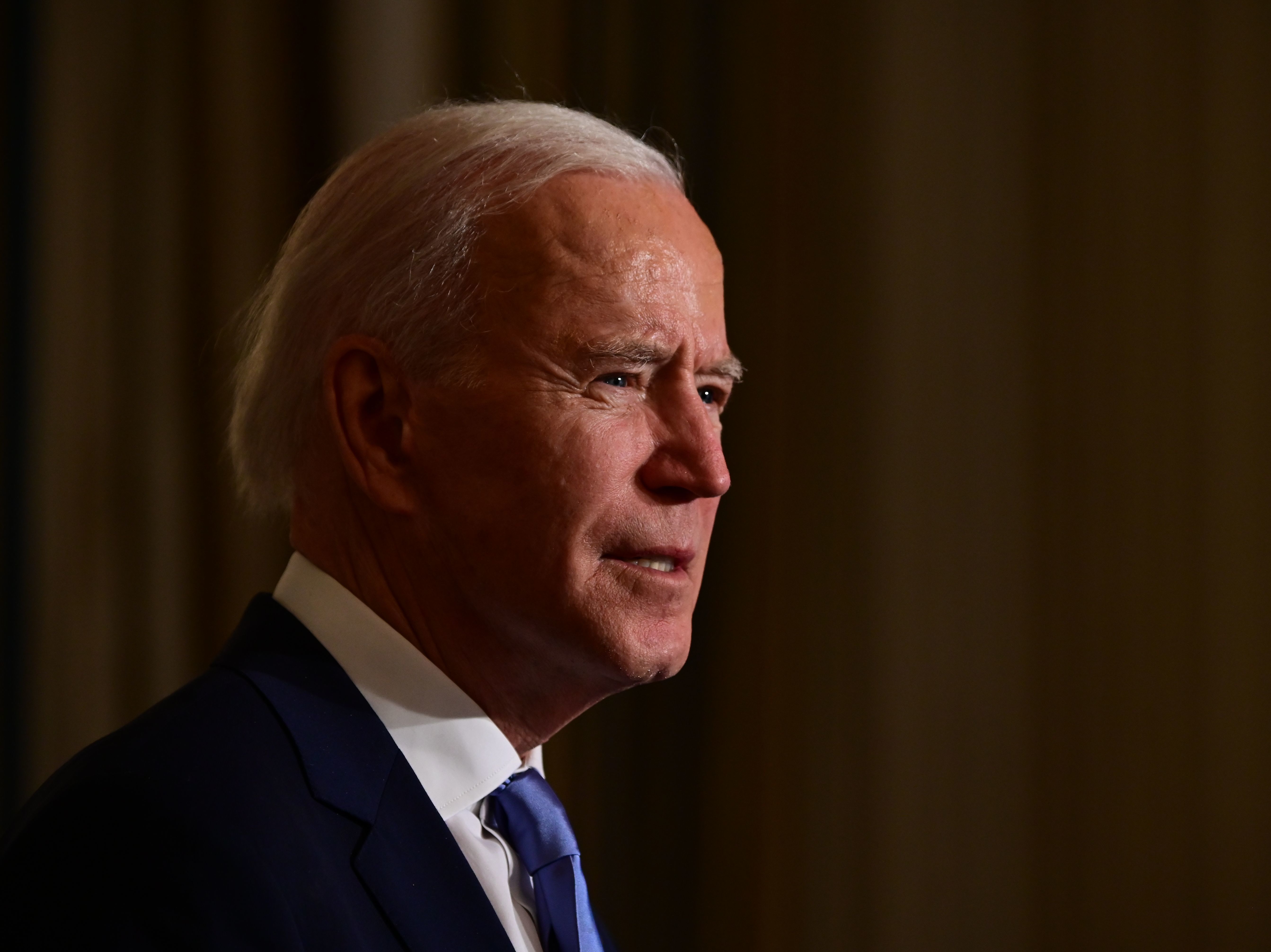 caption: President Biden swears in presidential appointees during a virtual ceremony in the State Dining Room of the White House on Wednesday. Data on Thursday showed new claims for state unemployment benefits reached 900,000, showcasing the weakening U.S. jobs picture.