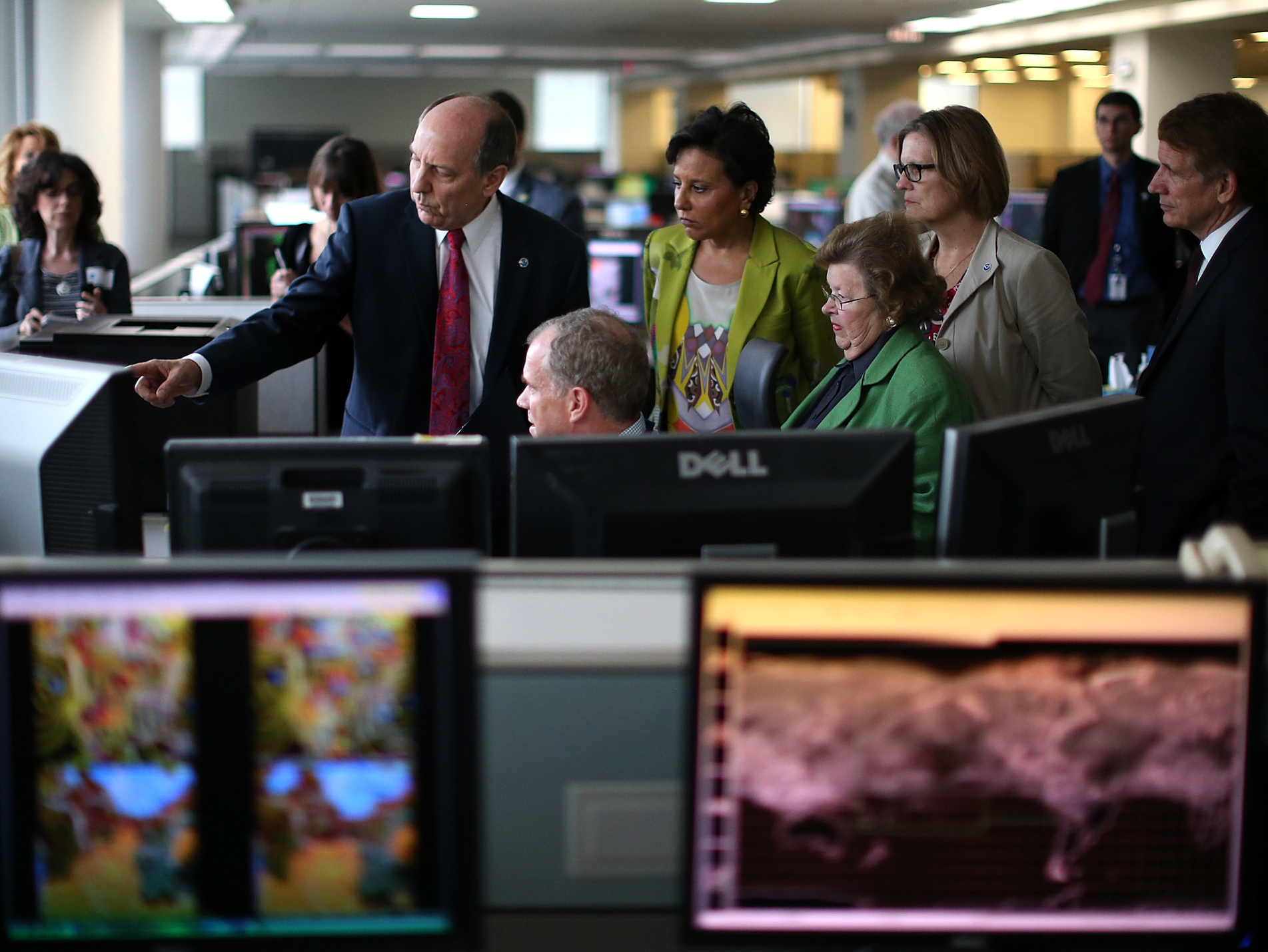 caption: NOAA's National Weather Service Director Louis Uccellini (L), gives a tour of NOAA's Center for Weather and Climate Prediction, to Commerce Secretary Penny Pritzker (2ndL), Sen. Barbara Mikulski (D-MD) (3rd-R), NOAA Acting Administrator Kathryn Sullivan (2nd-R), and Bryan Norcross (R),of the Weather Channel, , July 2, 2013 in Riverdale, Maryland.