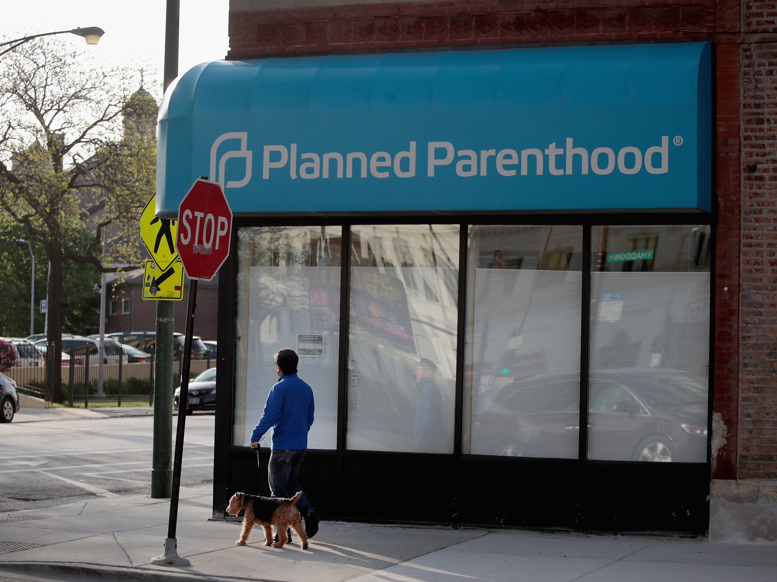 caption: A sign hangs over the front of a Planned Parenthood clinic on May 18, 2018 in Chicago, Illinois.