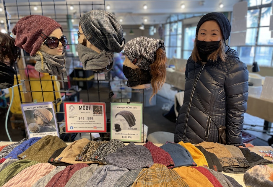Caption: Emmanuelle Shih sells "Grunge Beanies," also known as "Mobiis," at Pike Place Market.
