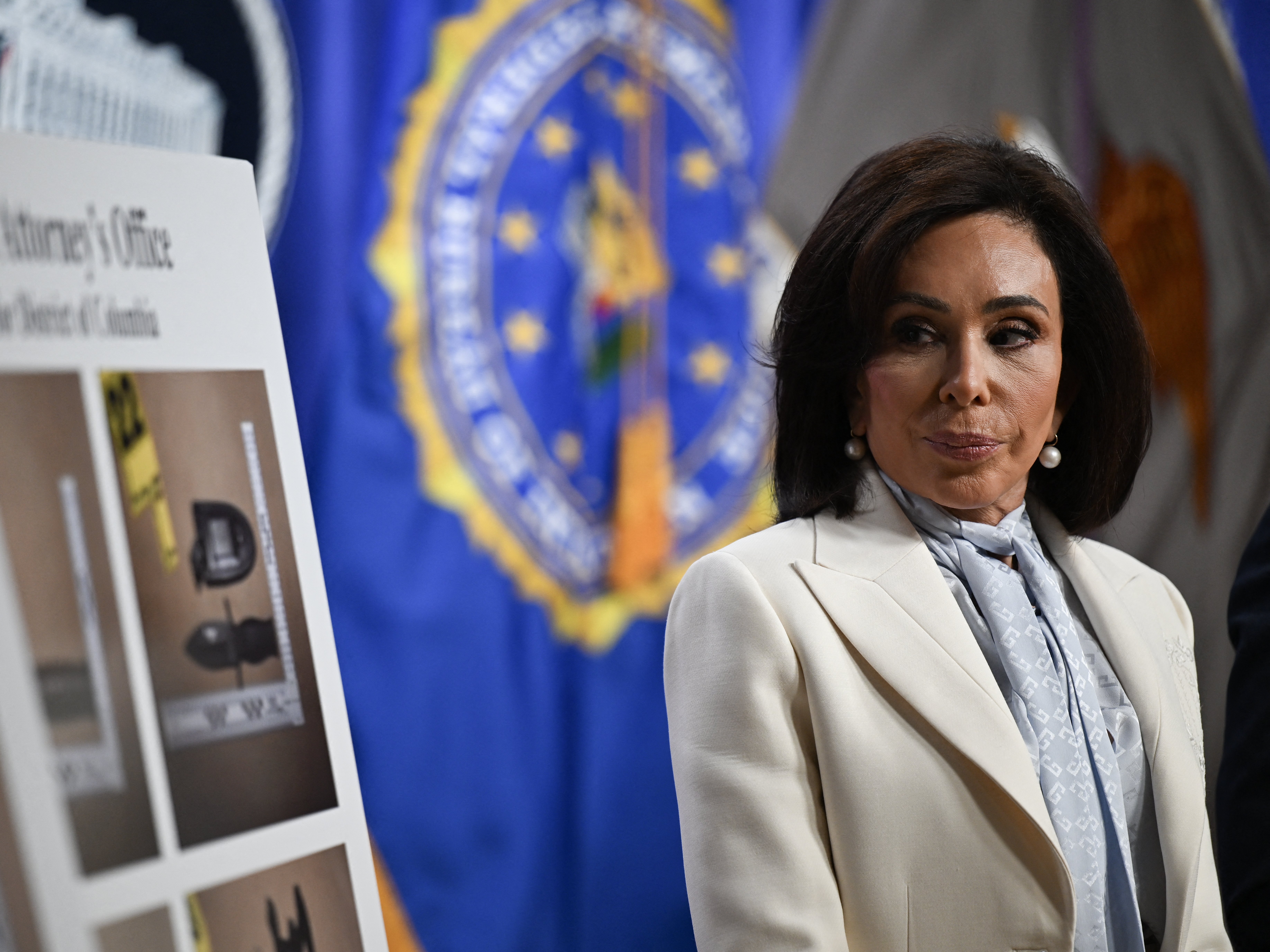 caption: U.S. Attorney for the District of Columbia Jeanine Pirro looks on during a news conference at Department of Justice headquarters in Washington, D.C., on April 27.