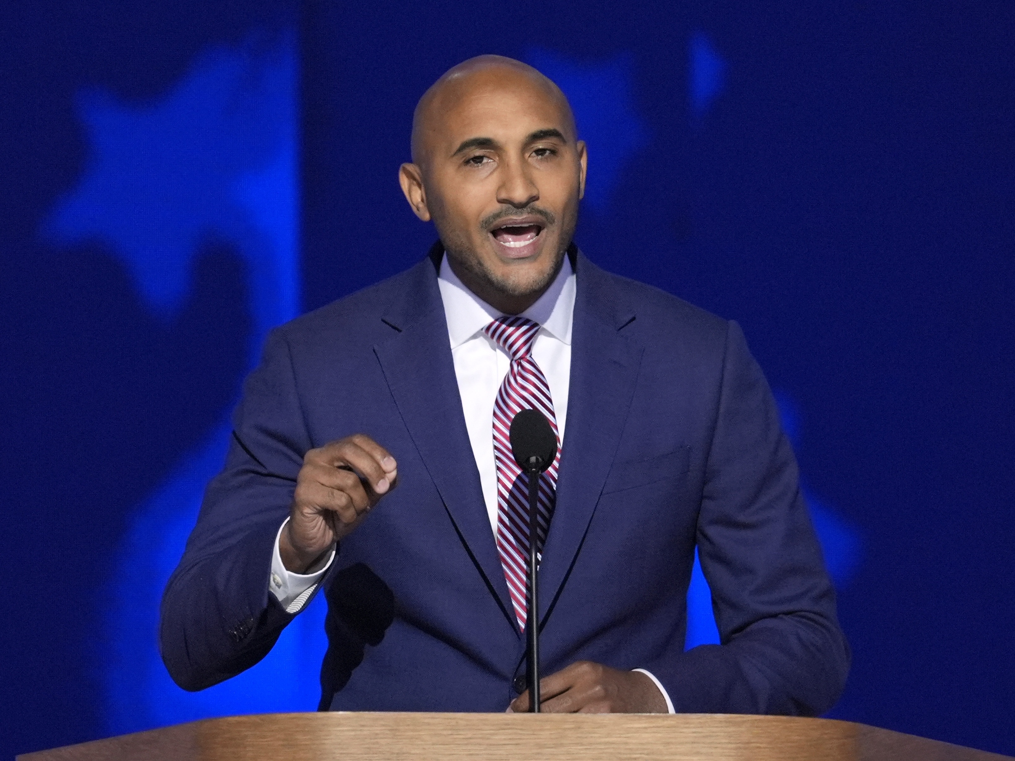 caption: Shomari Figures, speaking here at the Democratic National Convention on August 22, 2024, would win Alabama's 2nd Congressional District to become the state's second Black elected U.S. House member. The federal courts redrew the state's congressional map after determining the Republican-controlled state legislature failed to create a new district in 2023 that would give Black voters an opportunity to elect a candidate of their choice.