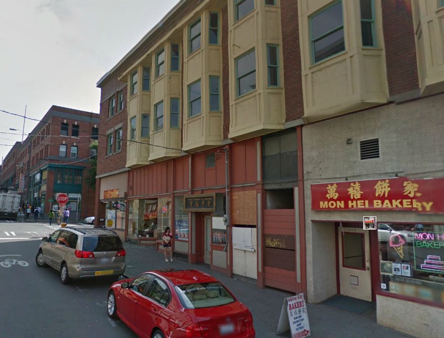 caption: The historic building, which once housed the Wah Mee Club, will be destroyed after the December fire.